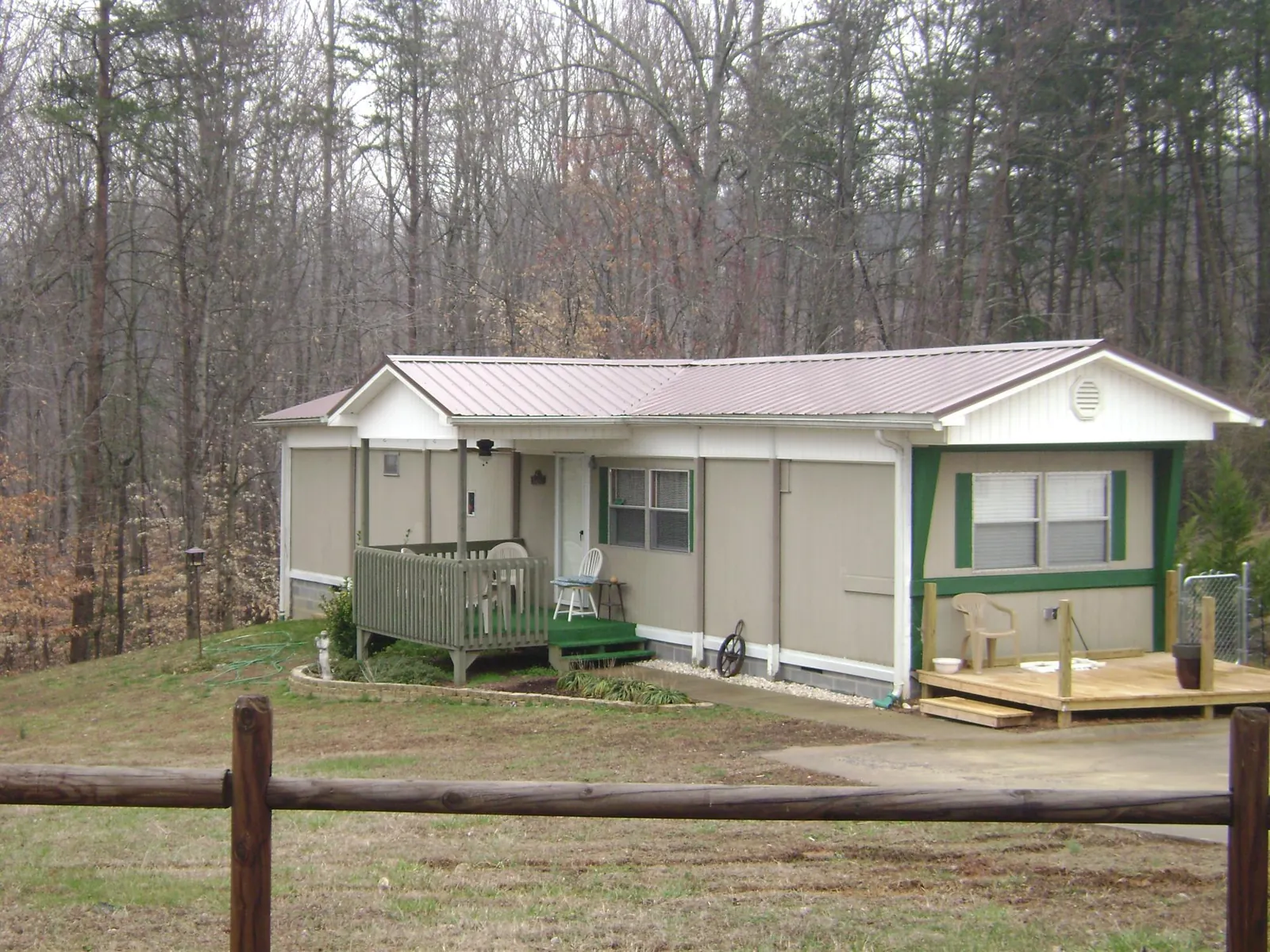 Mauve metal roof on a manufactured home with a new front deck in East Brunswick